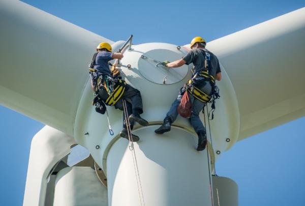 Inspectors working on a wind farm