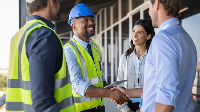 construction workers shaking hands