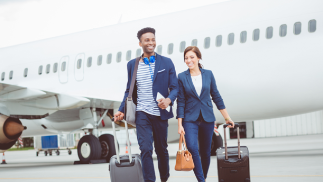 Travellers walking off a plane