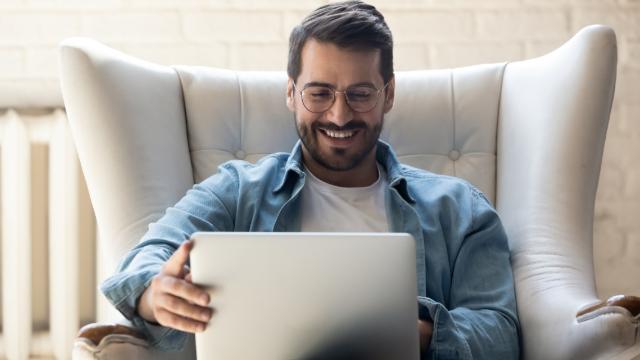 Man looking at his laptop for travel information