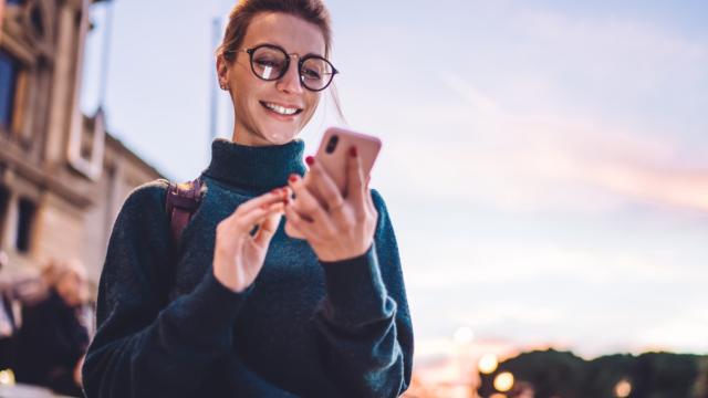 Young woman on her phone reading updates