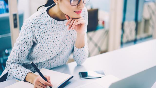 Young woman working at her desk