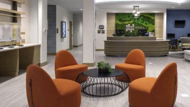 Hotel lobby from Even Hotels with orange relaxed chairs and modern design