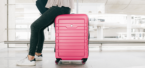 melon colored suitcase