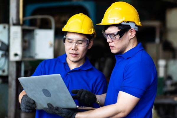 Pair of men looking at a laptop