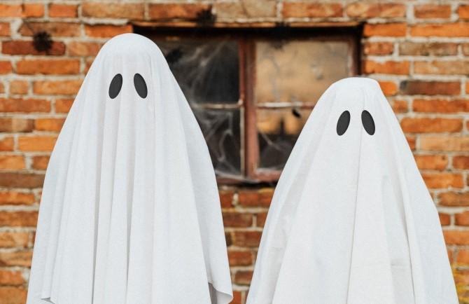 two people dressed as ghosts