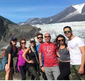 travel manager rob with friends at a glacier