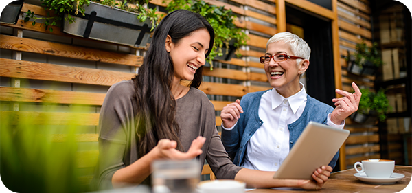 Two ladies talking over coffee.