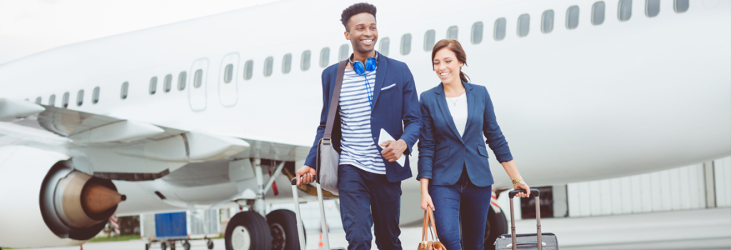 Travellers walking off a plane