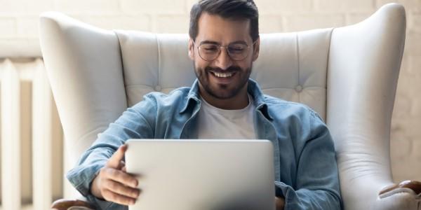 Man looking at his laptop for travel information