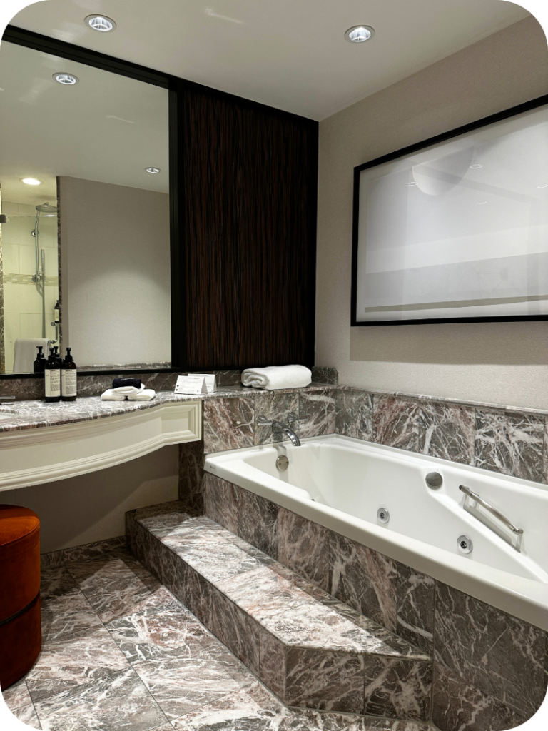 a hotel bathroom with bathtub