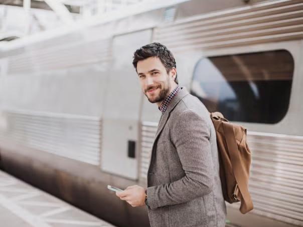 A man carrying a backpack representing the benefits of packing light for business trips. 