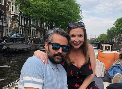 man and woman in a boat on the river 